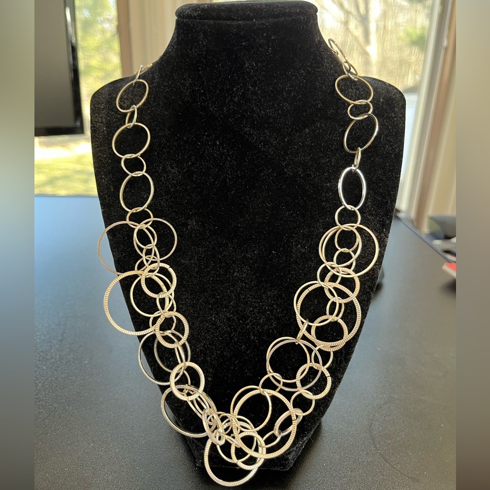 Silver colored metal ring adjustable necklace with hook eye closure w Earrings